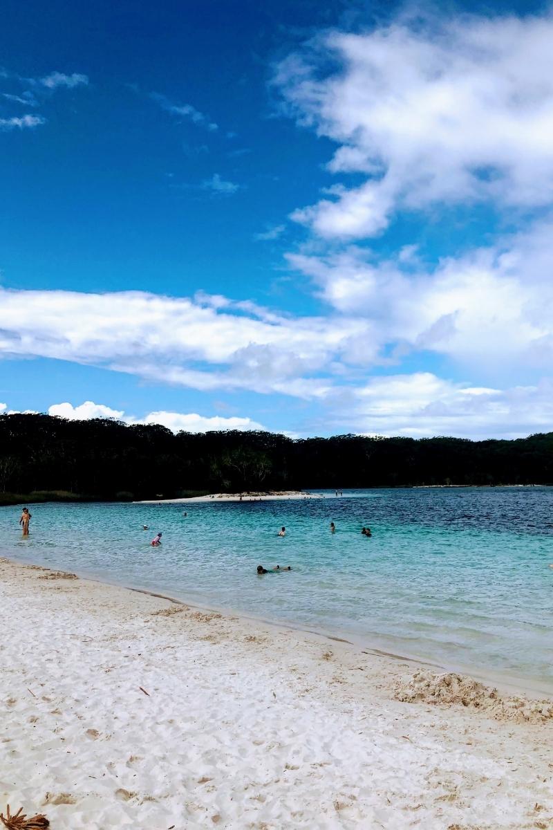 lake mckenzie on fraser island with blue water and blue skies