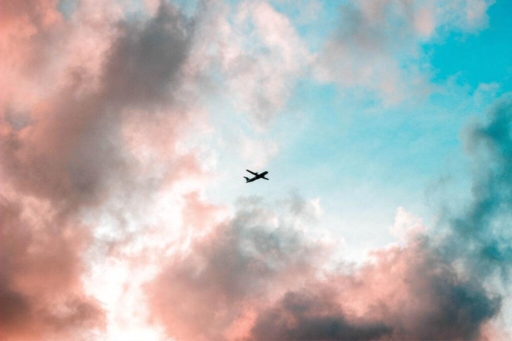 airplane in pink and blue sky