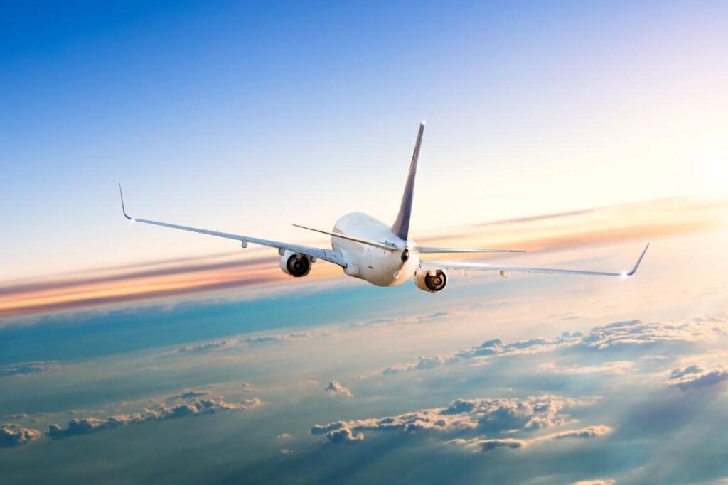 AIRPLANE FLYING THROUGH THE CLOUDS